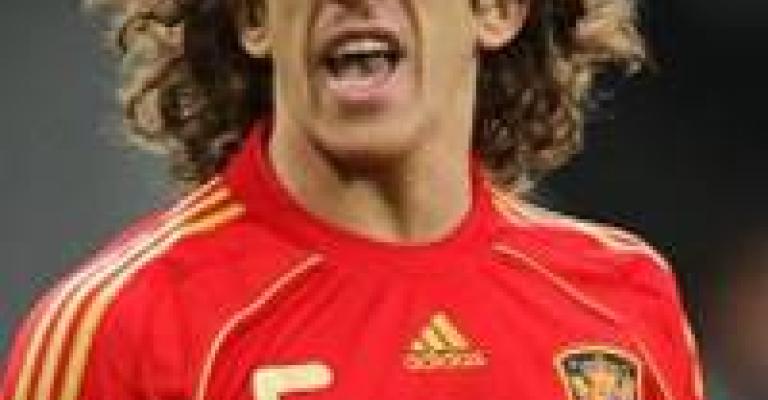 Barcelona's Carles Puyol commits to Spain for another 2 years Barcelona's Carles Puyol commits to Spain for another 2 years