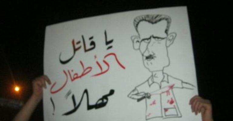 "صور" اعتصام شموع أمام السفارة السورية: شعب الأردن وسوريا وحدة حال