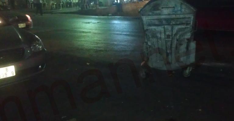 حاوية نفايات في منتصف شارع رئيسي- عدسة مصعب الشوابكه