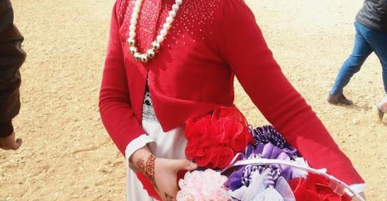 طفلة سورية تحتفل باليوم العالمي للطفل في مخيم الزعتري / تصوير فراس اللباد