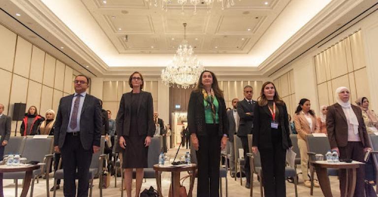 Panel attendees rise for the Jordanian national anthem. Panel attendees rise for the Jordanian national anthem.