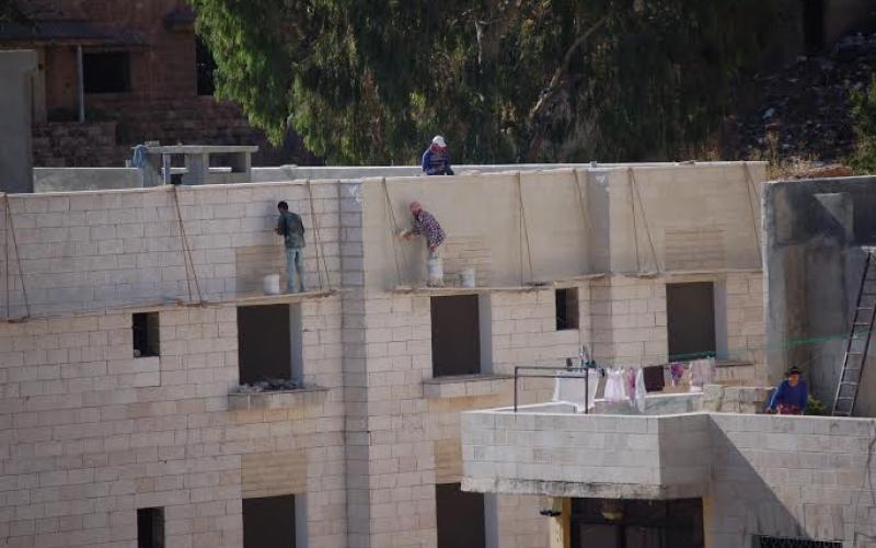 عمّال بناء في عمّان بعدسة غسان فرج