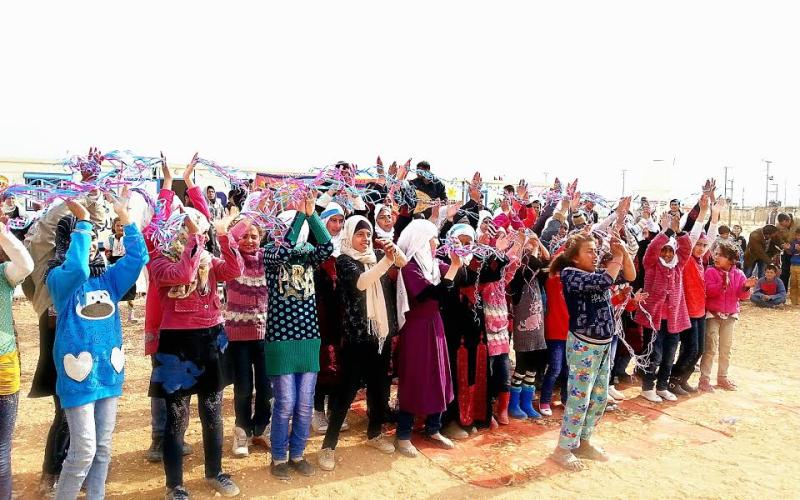 أطفال من مخيم الزعتري يشاركون بفعاليات اليوم العالمي للطفل/ تصوير فراس اللباد